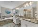 Bathroom with double vanity, soaking tub, and walk-in shower at 1592 Flange Dr, Davenport, FL 33896