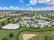 Aerial view of community amenities including pool and volleyball court at 1592 Flange Dr, Davenport, FL 33896
