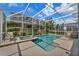 Inviting pool and spa with screened enclosure at 1592 Flange Dr, Davenport, FL 33896