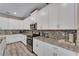 Kitchen with granite countertops and white cabinets at 1592 Flange Dr, Davenport, FL 33896