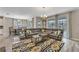 Open living space with sectional sofa, dining area, and pool view at 1592 Flange Dr, Davenport, FL 33896