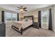 Main bedroom with king bed and ceiling fan at 1592 Flange Dr, Davenport, FL 33896
