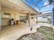 Screened patio with sliding glass doors leading to the interior at 5430 Sir Churchill Dr, Leesburg, FL 34748