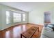 Living room with bay window and wood flooring at 5430 Sir Churchill Dr, Leesburg, FL 34748