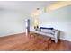 Spacious living room featuring hardwood floors and ample natural light at 5430 Sir Churchill Dr, Leesburg, FL 34748