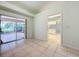 Bonus room with sliding glass doors leading to a screened patio at 5430 Sir Churchill Dr, Leesburg, FL 34748