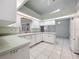 Bright kitchen with white cabinets and light countertops at 5430 Sir Churchill Dr, Leesburg, FL 34748