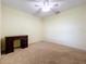 Bright bedroom with carpeted floor, ceiling fan, and a writing desk at 5430 Sir Churchill Dr, Leesburg, FL 34748