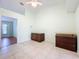 Light-filled bonus room with tile floors and views into another room at 5430 Sir Churchill Dr, Leesburg, FL 34748