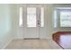 Entryway with white door and tile flooring at 5430 Sir Churchill Dr, Leesburg, FL 34748