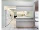 Kitchen with white appliances and breakfast bar at 5430 Sir Churchill Dr, Leesburg, FL 34748