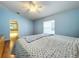 Bright bedroom with ceiling fan and neutral carpeting at 5430 Sir Churchill Dr, Leesburg, FL 34748