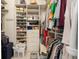 Large walk-in closet with ample shelving and hanging space at 8457 Se 177Th Penman Pl, The Villages, FL 32162