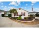 House exterior showcasing a manicured lawn and American flag at 8457 Se 177Th Penman Pl, The Villages, FL 32162