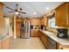 Modern kitchen boasting stainless steel appliances and ample counter space at 8457 Se 177Th Penman Pl, The Villages, FL 32162