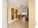 Bright entryway with tile flooring and mirrors at 8457 Se 177Th Penman Pl, The Villages, FL 32162