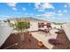 Backyard with red swing and landscaping at 8457 Se 177Th Penman Pl, The Villages, FL 32162