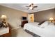 Cozy bedroom with ceiling fan and dresser at 8457 Se 177Th Penman Pl, The Villages, FL 32162