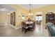 Dining room featuring a wooden table, chairs, and floral centerpiece at 8457 Se 177Th Penman Pl, The Villages, FL 32162