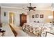 Serene bedroom with a king-size bed and adjacent bathroom at 8457 Se 177Th Penman Pl, The Villages, FL 32162
