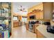 Well-equipped kitchen with light wood cabinets and stainless steel appliances at 8457 Se 177Th Penman Pl, The Villages, FL 32162