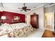 Main bedroom with a king-size bed and an ensuite bathroom at 8457 Se 177Th Penman Pl, The Villages, FL 32162
