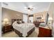 Comfortable bedroom with ceiling fan and ample closet space at 8457 Se 177Th Penman Pl, The Villages, FL 32162