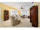 Spacious living room with comfortable seating and large windows at 8457 Se 177Th Penman Pl, The Villages, FL 32162