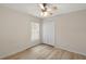 Bright bedroom with ceiling fan and laminate flooring at 12900 Cloverdale Ln, Clermont, FL 34711