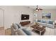 Living room with hardwood floors, and neutral color palette at 12900 Cloverdale Ln, Clermont, FL 34711