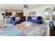Spacious living room with sectional sofa, and access to kitchen and bathroom at 275 Cr 552, Bushnell, FL 33513