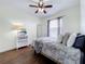 Serene bedroom with wood floors, window, and ceiling fan at 275 Cr 552, Bushnell, FL 33513