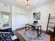 Bright office with wood floors, built-in shelves, and a comfortable seating area at 275 Cr 552, Bushnell, FL 33513