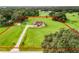 Aerial view of property showing house, detached garage, and large lot at 275 Cr 552, Bushnell, FL 33513