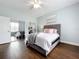 Bedroom with hardwood floors, mirrored closet doors and a ceiling fan at 275 Cr 552, Bushnell, FL 33513