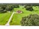 Aerial view of a house on a large lot with lush greenery at 275 Cr 552, Bushnell, FL 33513