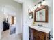 Charming bathroom with a classic vanity and a view to the living room at 275 Cr 552, Bushnell, FL 33513