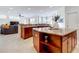 Large kitchen island with granite countertops and wooden cabinets at 275 Cr 552, Bushnell, FL 33513