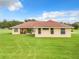 Ranch-style home with a red tile roof and a large backyard at 275 Cr 552, Bushnell, FL 33513