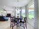 Bright breakfast nook with a table and chairs, overlooking a golf course at 275 Cr 552, Bushnell, FL 33513