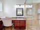 Bathroom boasts a vanity with granite countertops and a walk-in shower at 275 Cr 552, Bushnell, FL 33513