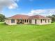Ranch-style home with a red tile roof and a large backyard at 275 Cr 552, Bushnell, FL 33513