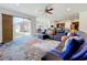 Living room with sectional sofa, large rug, and sliding doors to backyard at 275 Cr 552, Bushnell, FL 33513