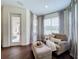 Relaxing sitting area with comfy chair and ottoman, and access to a patio at 275 Cr 552, Bushnell, FL 33513