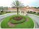 Community clubhouse with circular driveway at 2112 Saint Ives Ct, Clermont, FL 34711