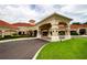 Community clubhouse with covered entryway and landscaping at 2112 Saint Ives Ct, Clermont, FL 34711