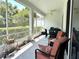 Spacious screened porch with seating area for relaxing at 2277 Calvert Ct, Clermont, FL 34711