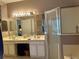 Bathroom boasts a double vanity, separate shower and tub, and updated fixtures at 2277 Calvert Ct, Clermont, FL 34711