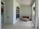 Inviting front porch with a white wicker settee, perfect for relaxing at 2277 Calvert Ct, Clermont, FL 34711