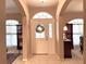 Bright and spacious entryway with a decorative glass front door at 2277 Calvert Ct, Clermont, FL 34711